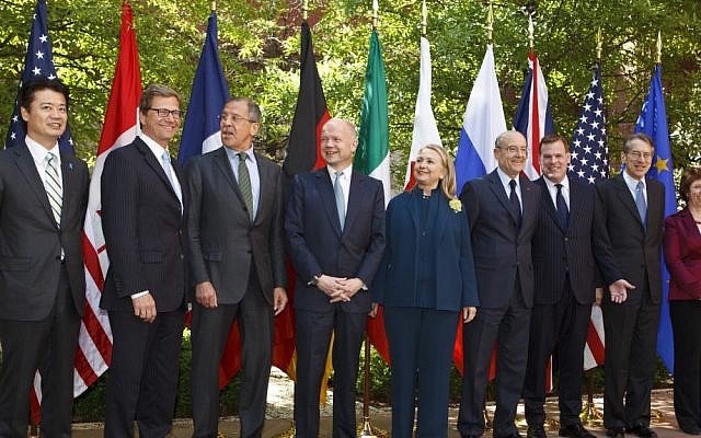 Secretary of State Hillary Clinton hosts a gathering of the G-8 foreign ministers at Blair House in Washington, April 11, 2012. From left are: Japanese Foreign Minister Koichiro Gemba, German Foreign Minister Guido Westerwelle, Russian Foreign Minister Sergey Lavrov, British Foreign Secretary William Hague, US Secretary of State Hillary Clinton, French Foreign Minister Alain Juppe, Canadian Foreign Minister John Baird, Italy's Foreign Minister Giulio Terzi di Sant' Agata and EU Foreign Minister Catherine Ashton. (photo credit: AP Photo/J. Scott Applewhite)