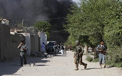 Afghan security forces are seen after a suicide attack on the US-led provincial reconstruction team (PRT) compound in the Behsood district of Jalalabad, east of Kabul, Afghanistan, on Sunday, April 15, 2012. (Photo credit: AP Phot/Rahmat Gul) Afghan security forces are seen after a suicide attack on the US-led provincial reconstruction team (PRT) compound in the Behsood district of Jalalabad, east of Kabul, Afghanistan, on Sunday, April 15, 2012. (Photo credit: AP Phot/Rahmat Gul)