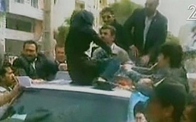 A female protester confronts Mahmoud Ahmadinejad in Bandar-Abbas. (photo credit: Channel 2 screen capture)