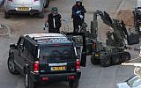A police bomb squad unit neutralized a bomb hidden in a jeep in Bnei Brak in January, 2011 (photo credit: Roni Schutzer/Flash90)