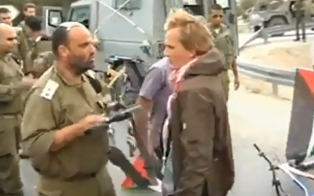 Lt. Col. Shalom Eisner facing Danish pro-Palestinian protester Andreas Ayas (screen capture: from YouTube)
