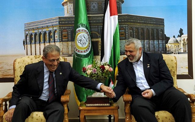 Amr Moussa (left) jokes with Hamas prime minister Ismail Haniyeh during a visit to Gaza in 2010 (photo credit: Abed Rahim Khatib/Flash 90)