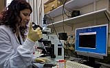 Illustrative: A life science graduate student does research at the Weizmann Institute of Science in Rehovot. (Doron Horowitz/Flash90)