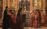 Greek Orthodox clergymen attend a procession inside the Church of the Holy Sepulchre in Jerusalem's Old City (photo credit: Nati Shohat/Flash90/File)