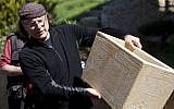 Documentary filmmaker Simcha Jacobovici shows a life-size replica of one of the ossuaries found in 'Patio Tomb,' a first century burial cave located beneath an apartment building, on April 4, 2012 in Jerusalem, Israel. (Lior Mizrahi / FLASH 90)
