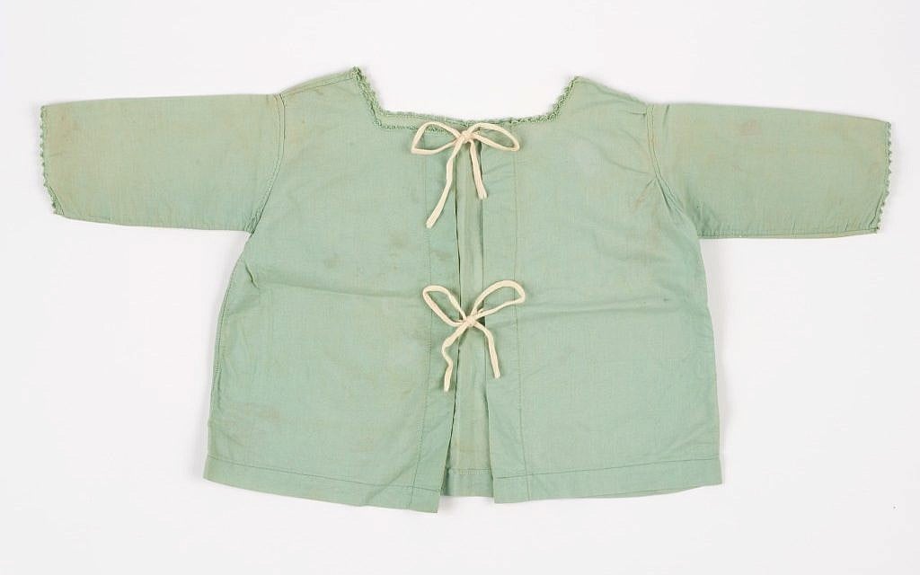The shirt worn by Nina Denty Abayov's baby brother, found in their Athens home after the war (Courtesy Yad Vashem) The shirt worn by Nina Denty Abayov's baby brother, found in their Athens home after the war (Courtesy Yad Vashem)