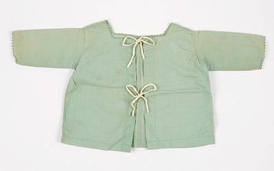 The shirt worn by Nina Denty Abayov's baby brother, found in their Athens home after the war (Courtesy Yad Vashem)