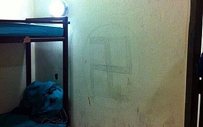 Swastika graffiti found on the wall at Ben Gurion Airport this week (photo credit: Courtesy the Immigration and Border Authority)