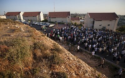 A prayer service held Monday outside the Ulpana neighborhood houses slated for demolition (Photo credit: Flash 90)