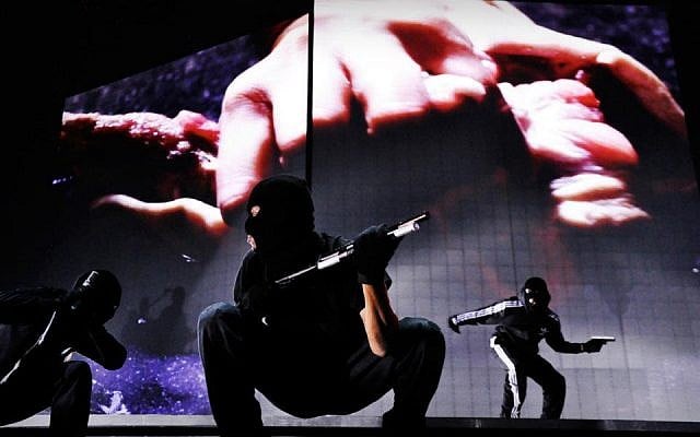 Guns 'n dancers on the MDNA stage (Courtesy official Madonna Facebook page)