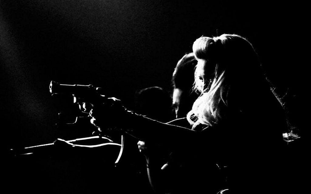 Madge gets her gun (Courtesy official Madonna Facebook page) Madge gets her gun (Courtesy official Madonna Facebook page)