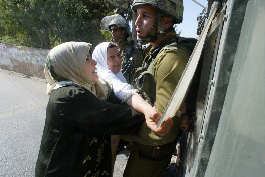 Emad's mother pleads with an Israeli soldier to release her son Khaled after he was arrested. (photo credit: Kino Lorber) Emad's mother pleads with an Israeli soldier to release her son Khaled after he was arrested. (photo credit: Kino Lorber)