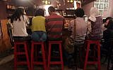 Iranian youths sit at a cafe in Tehran (AP/Hasan Sarbakhshian)