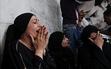 Egyptian women mourn the death of protesters in Cairo Wednesday (photo credit: AP/Mohammed Asad)