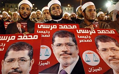 Several hundreds Imams listen to Muslim Brotherhood's presidential candidate Mohammed Morsi at a rally in Cairo, Egypt, Sunday, May 20, 2012 (photo credit: AP Photo/Fredrik Persson)