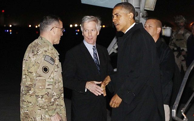 US President Barack Obama is greeted by Lt. Gen. Curtis "Mike" Scaparrotti and US Ambassador to Afghanistan Ryan Crocker as he steps off Air Force One at Bagram Air Field in Afghanistan, May 1, 2012. (photo credit: Charles Dharapak/AP)