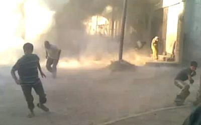Amateur footage purportedly of the Houla massacre in Syria in May (photo credit: AP)