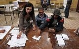 Algerians vote in Algiers Thursday (photo credit: AP Photo/Paul Schemm)