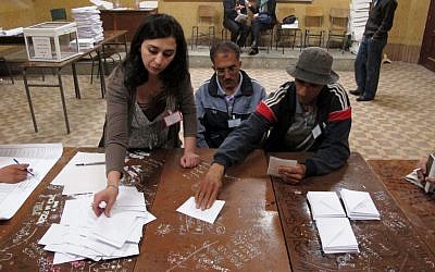 Algerians vote in Algiers Thursday (photo credit: AP Photo/Paul Schemm)