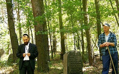 At the Jewish cemetery in Warsaw. (photo credit: Kuba Wyszynski/JTA)