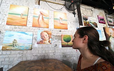 "Beach coming triptych" (top) and other works by Dina Argov (photo credit: David Katz)