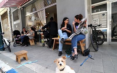 Customers eat outside and indoors at the Devotchka Sandwich Bar just south of the Levinsky Spice Market (photo credit: David Katz)