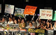 "We support a revolution of love," and "We are for responsibility," read signs carried by protesters at the social demonstrations in Tel Aviv's Rabin Square Saturday (photo credit: Michal Shmulovich/Times of Israel)
