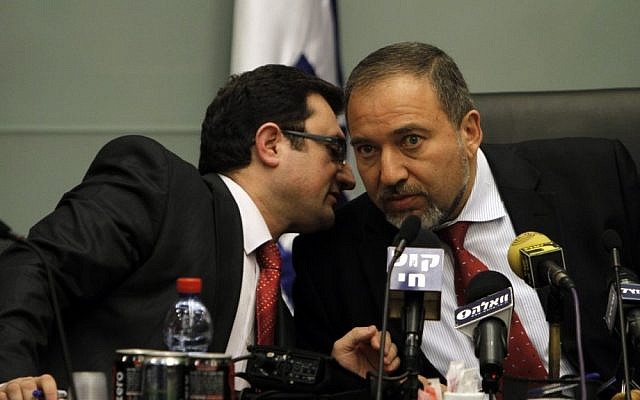 MK Robert Ilatov (left) speaks with Yisrael Beytenu head Avigdor Liberman during a party meeting at the Knesset (Miriam Alster/Flash90) MK Robert Ilatov (left) speaks with Yisrael Beytenu head Avigdor Liberman during a party meeting at the Knesset (Miriam Alster/Flash90)