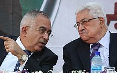 Former Palestinian Authority Prime Minister Salam Fayyad (left) with Palestinian Authority President Mahmoud Abbas in 2012 (Issam Rimawi/Flash90/ File)