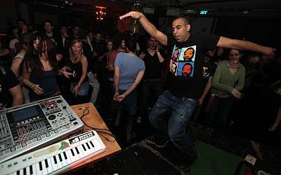 Young Israelis party in Jerusalem (illustrative photo: Abir Sultan/Flash90)