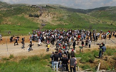 Protesters making their way across Israel's border during last year's Nakba Day demonstrations along the Syrian border (Photo credit: Hamad Almakt/ Flash 90)
