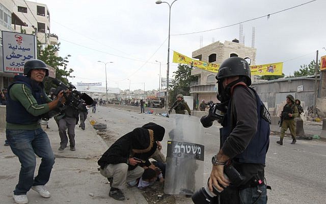 Protests at Qalandiya in 2011. (photo credit: Nati Shohat/Flash90)