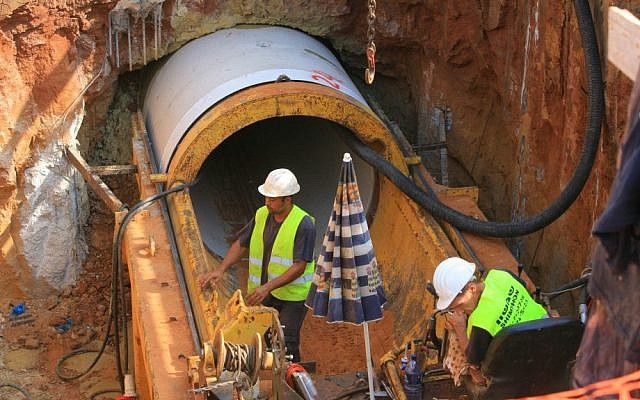 Engineers work on a new set of underground sewage pipes in Netanya (Photo credit: Chen Leopold/Flash90)