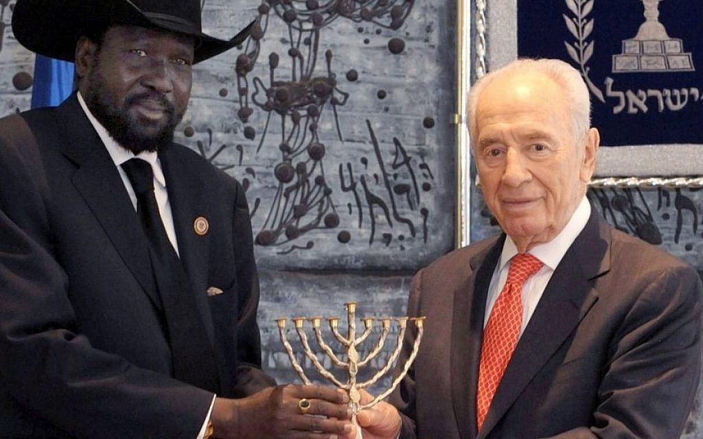 President Shimon Peres presents South Sudanese President Salva Kiir Mayardit with a menorah in Jerusalem in December. (photo credit: Mark Neyman/GPO/Flash90) President Shimon Peres presents South Sudanese President Salva Kiir Mayardit with a menorah in Jerusalem in December. (photo credit: Mark Neyman/GPO/Flash90)