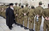 Watching soldiers at an army ceremony at the Western Wall (photo credit: Yonatan Sindel/ Flash 90 )