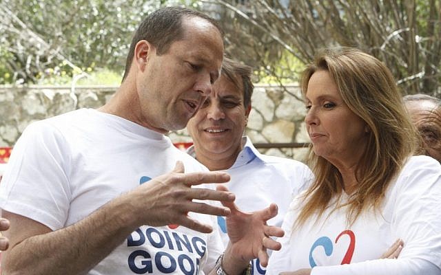 Shari Arison and Jerusalem Mayor Nir Barkat tend a garden of a public housing building on Good Deed Day in March (photo credit: Uri Lenz/Flash90) Shari Arison and Jerusalem Mayor Nir Barkat tend a garden of a public housing building on Good Deed Day in March (photo credit: Uri Lenz/Flash90)
