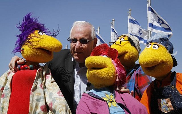 Knesset Speaker Reuven Rivlin poses with dolls from a children's TV show. (photo credit: Miriam Alster/Flash90) Knesset Speaker Reuven Rivlin poses with dolls from a children's TV show. (photo credit: Miriam Alster/Flash90)