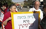 Left-wing activists protest against Jewish settlement in Jerusalem's predominantly Arab neighborhood of Sheikh Jarrah in April. (photo credit: Sliman Khader/Flash90)