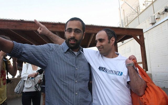 Hagai Amir flashes a "V" for victory upon exiting Ayalon Prison on Friday (photo credit: Roni Schutzer/Flash90)
