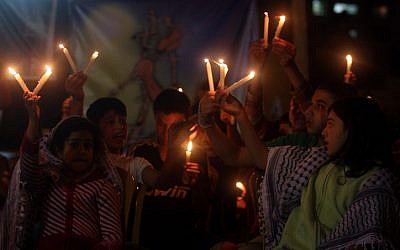 Palestinian children in Ramallah light candles during a May rally in solidarity with prisoners who have been waging a hunger strike in Israeli jails (photo credit: Issam Rimawi/Flash 90)