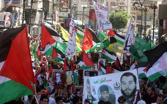 Hamas supporters hold a rally in the West Bank city of Ramallah, calling for the release of Palestinians being held in Israeli prisons on Friday (photo credit: Issam Rimawi/Flash 90) Hamas supporters hold a rally in the West Bank city of Ramallah, calling for the release of Palestinians being held in Israeli prisons on Friday (photo credit: Issam Rimawi/Flash 90)