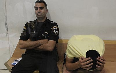 Eden Ohayon, the then-18-year-old suspect in the murder of Gadi Vichman in a court hearing in Beersheba in 2012. (Tsafrir Abayov/Flash90)