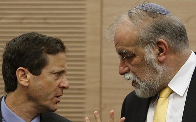 David Rotem (right) speaks to Isaac Herzog at the Knesset on Monday morning (photo credit: Miriam Alster/Flash90)