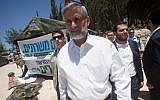 Eli Yishai visits protesters calling for an equal distribution of national service last month (photo credit: Uri Lenz/Flash90)