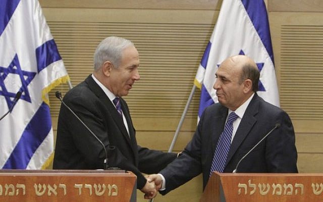Prime minister Benjamin Netanyahu and  Kadima chairman Shaul Mofaz, hold a joint press conference announcing a new unity government, on Tuesday (photo credit: Miriam Alster/Flash90)
