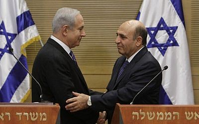 Prime Minister Benjamin Netanyahu, left, and Kadima chairman Shaul Mofaz deliver a joint press conference at the Knesset on May 8, announcing Kadima's entry into the governing coalition. For many pundits, entering the Netanyahu government was Mofaz's fatal mistake. (photo credit: Miriam Alster/Flash90)