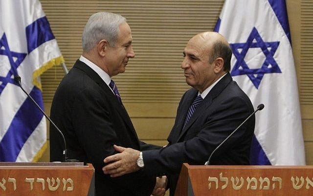 Prime Minister Benjamin Netanyahu, left, and Kadima chairman Shaul Mofaz deliver a joint press conference at the Knesset on May 8, announcing Kadima's entry into the governing coalition. For many pundits, entering the Netanyahu government was Mofaz's fatal mistake. (photo credit: Miriam Alster/Flash90)