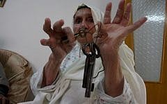 An elderly woman in the West Bank city of Ramallah displaying the keys to a previous home, before the Israeli victory in 1948. (Photo credit: Issam Rimawi/ Flash 90)