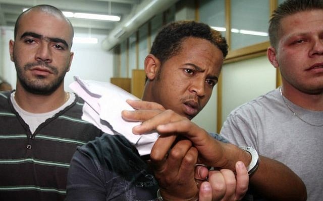 One of the three Eritreans suspected of raping a 15-year-old girl near the Central Bus Station in Tel Aviv on Independence Day. (photo credit: Roni Schutzer/Flash90) One of the three Eritreans suspected of raping a 15-year-old girl near the Central Bus Station in Tel Aviv on Independence Day. (photo credit: Roni Schutzer/Flash90)