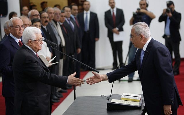 Palestinian Authority President Mahmoud Abbas swears in his new cabinet (photo credit: Issam Rimawi/Flash90) Palestinian Authority President Mahmoud Abbas swears in his new cabinet (photo credit: Issam Rimawi/Flash90)